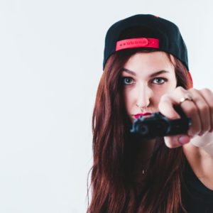 woman holding pistol